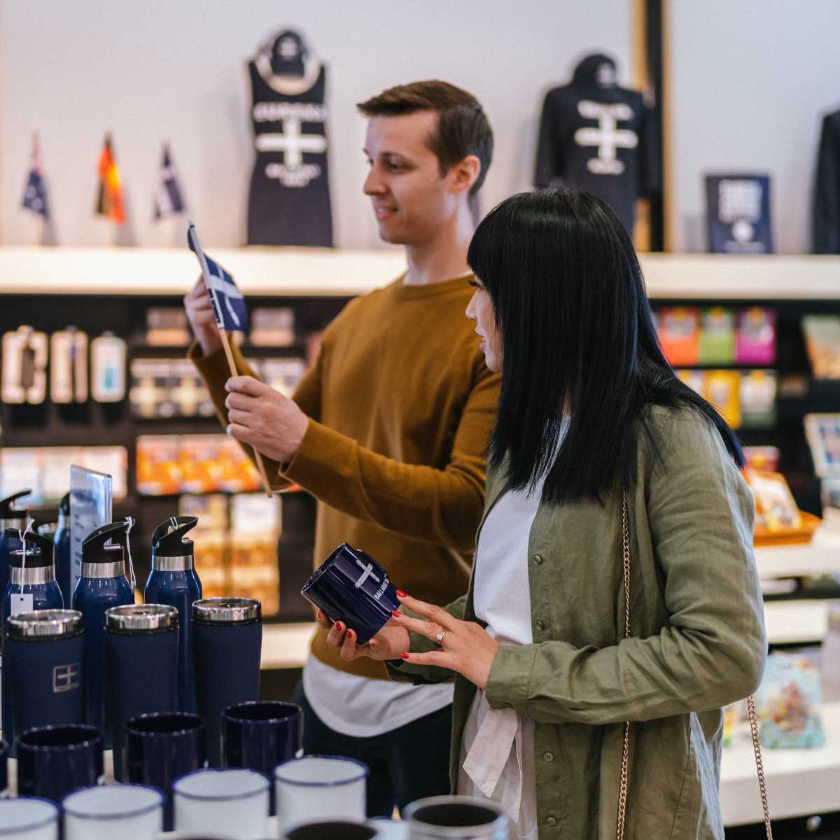 a man and a women standing together and browsing items in the Eureka Centre giftshop